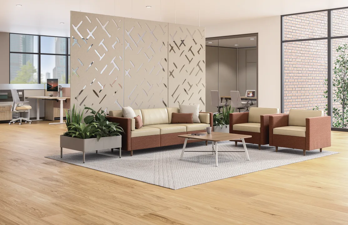 Open workplace lounge with sofas and natural light