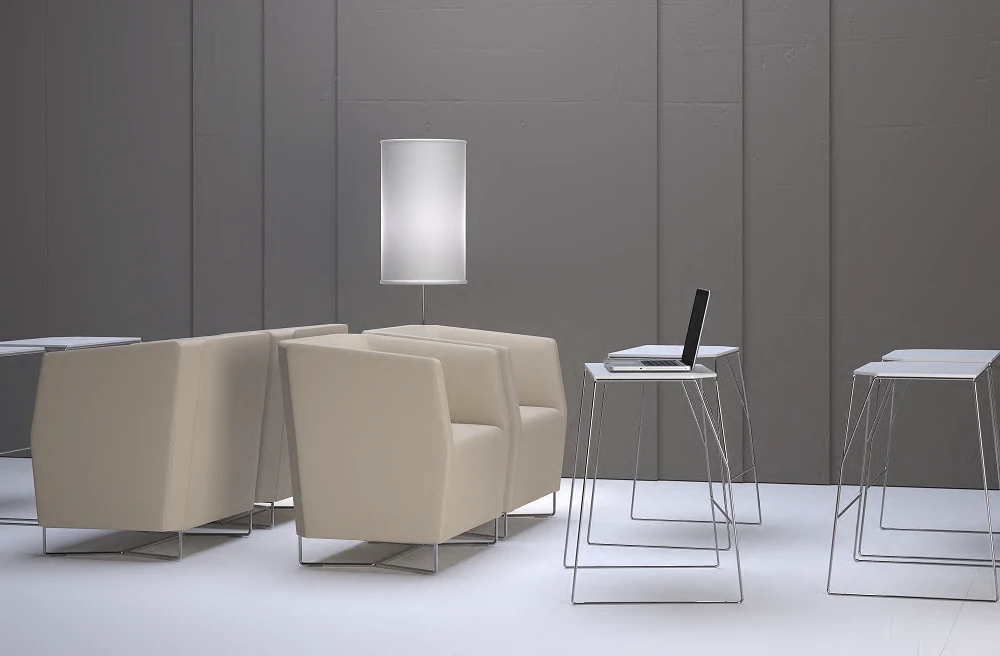 Laptop pull-up tables beside lounge seating