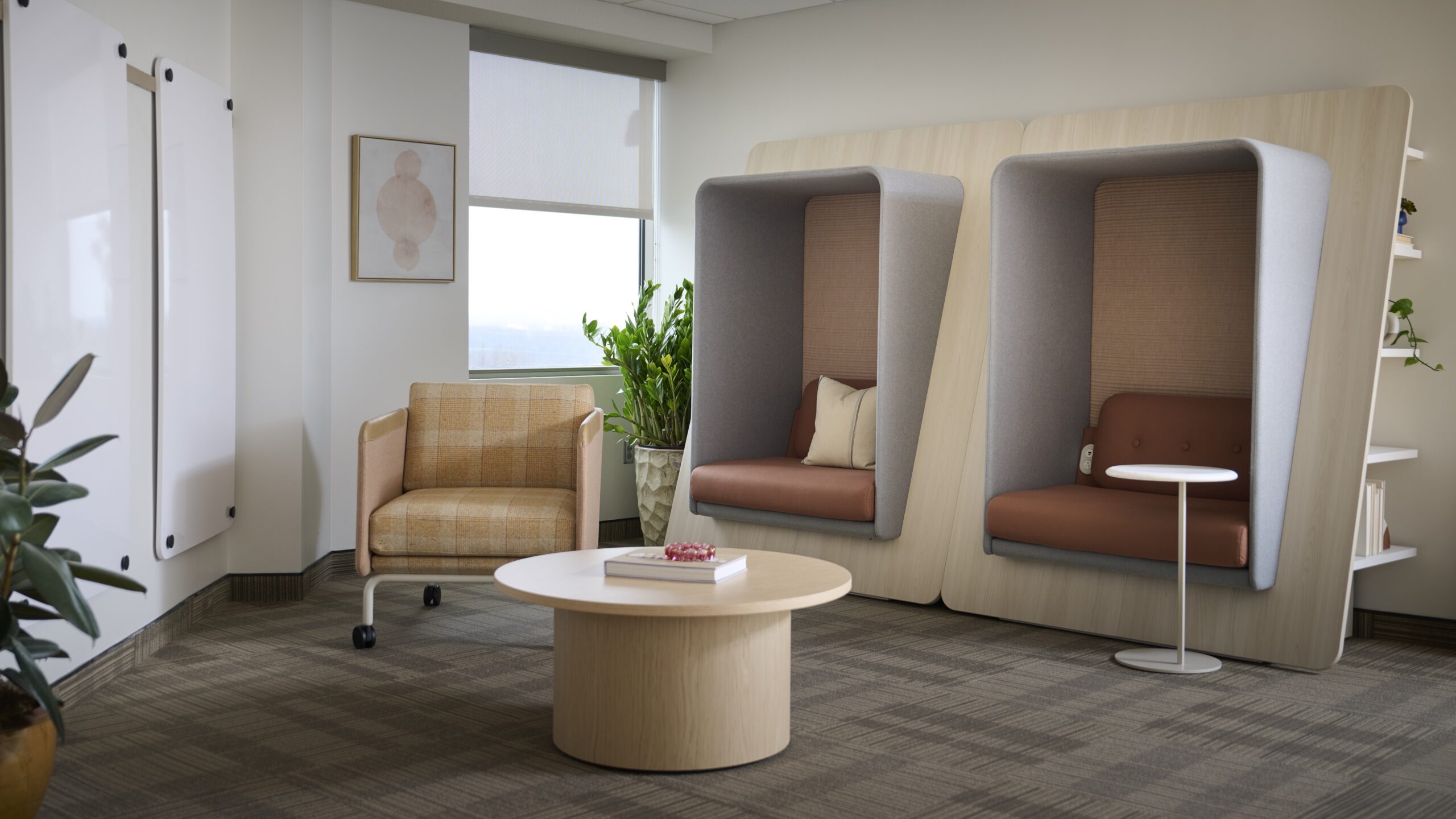 Enclosed focus room with desk and task chair