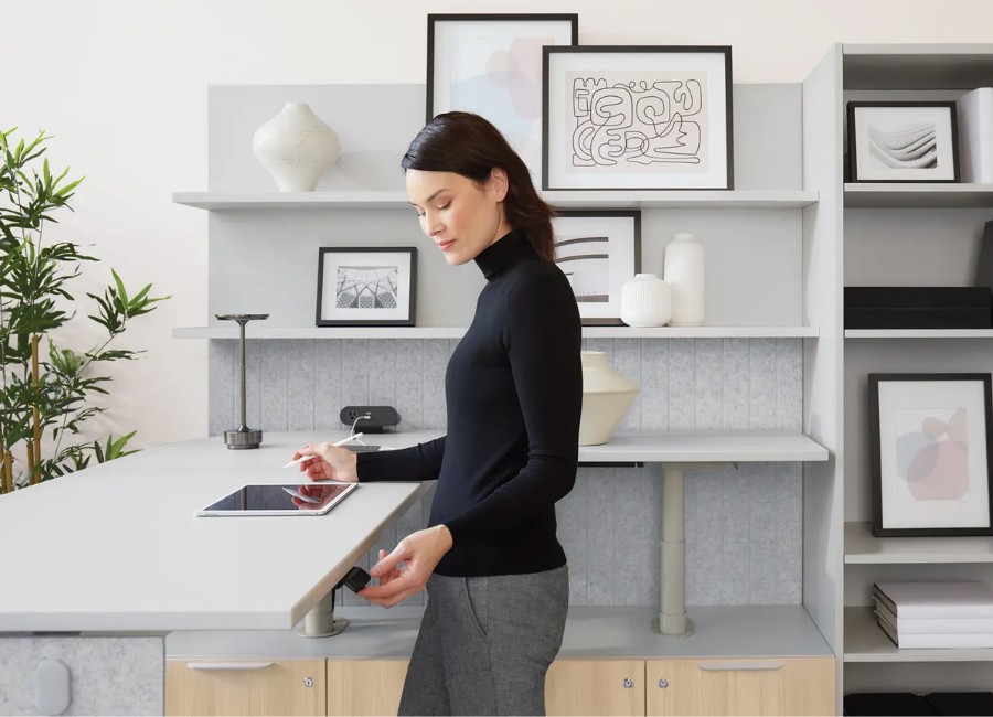 Height-adjustable desk configured as an ergonomics workstation