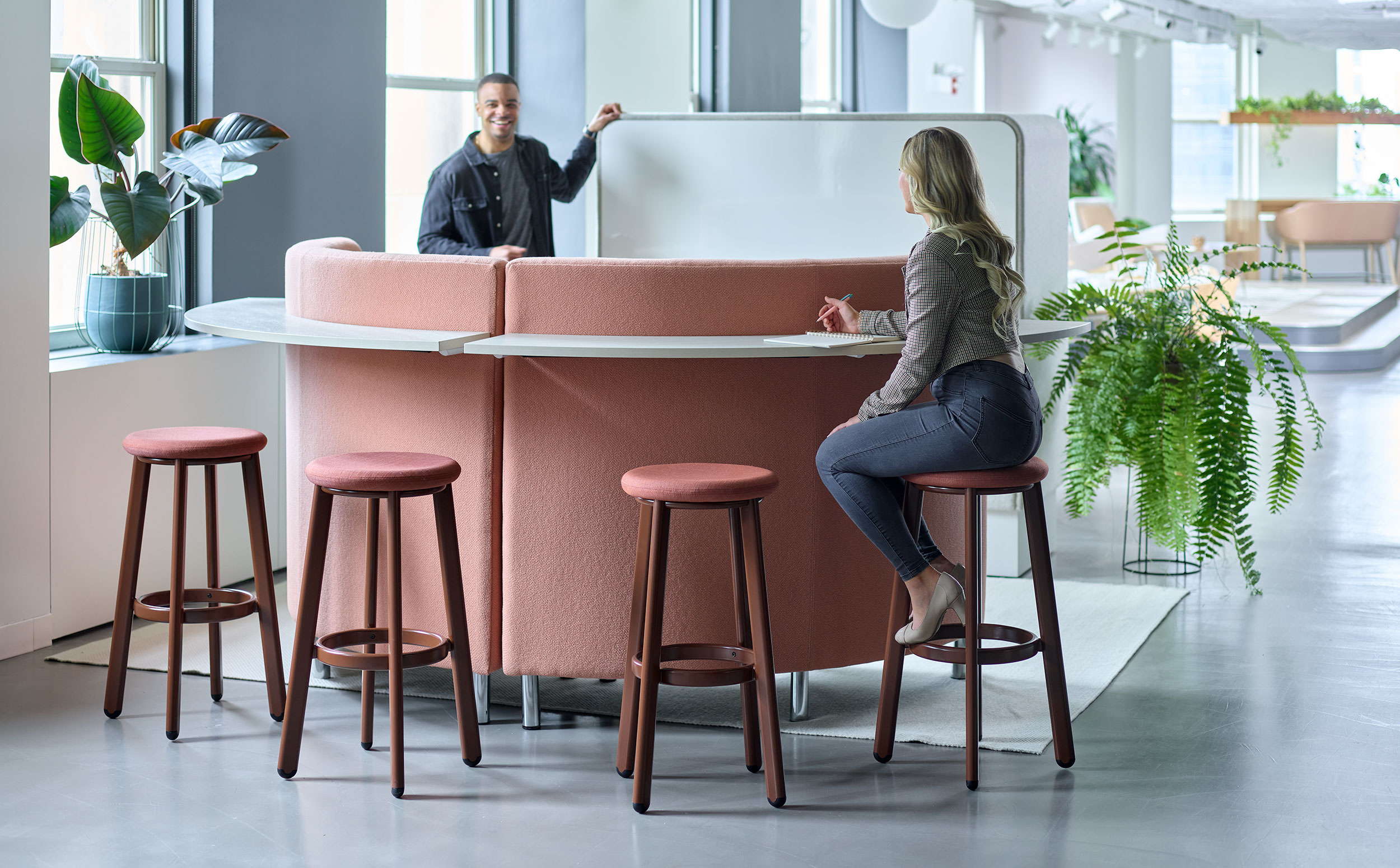 Employees collaborating in an informal workplace lounge
