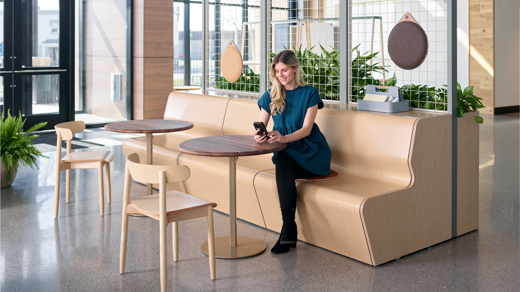 Corporate employee cafe with dining and casual work seating