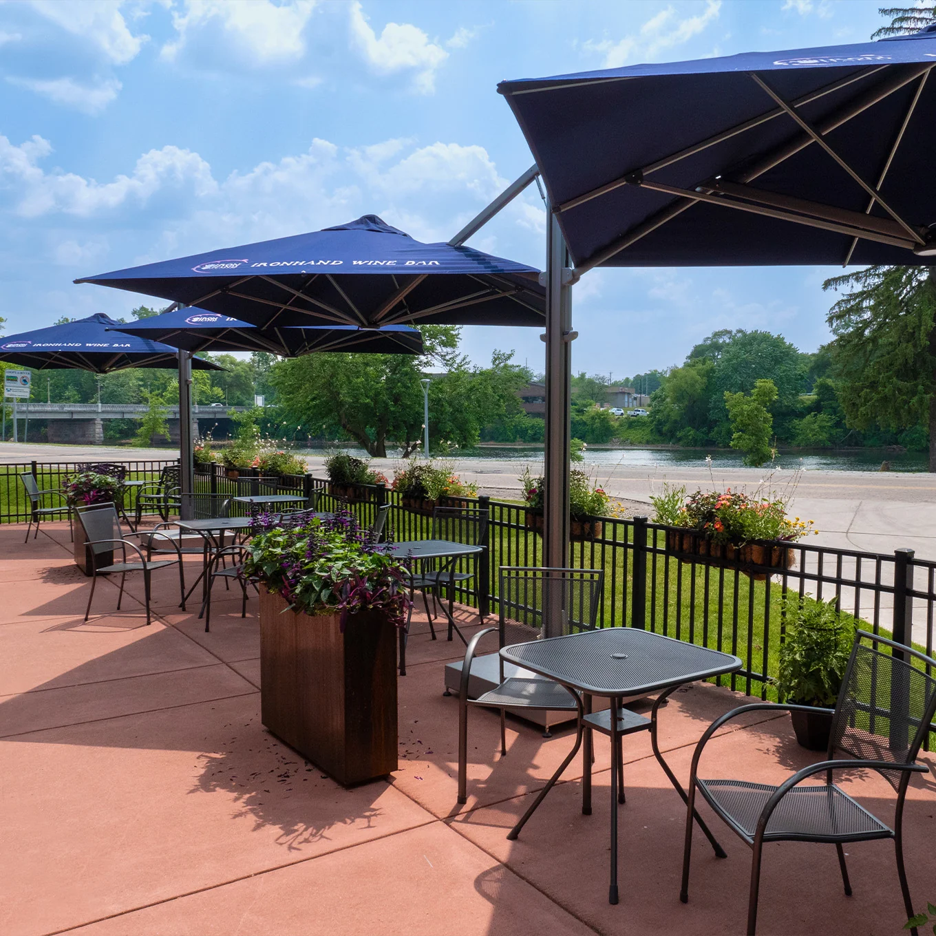 Commercial outdoor seating beneath shade